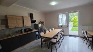 a kitchen and dining room with a table and chairs at JURAJSKI OLSZTYN in Olsztyn +7 photos
