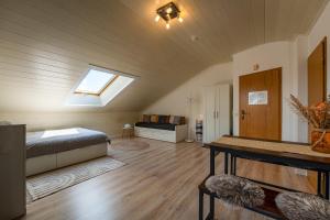 a bedroom with a bed and a skylight at Ferienwohnung Kampenwand in Bad Endorf