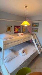 a bedroom with a bunk bed with a light at Villa VG- Calm and relax in Nea Vrasna