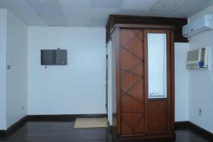 an empty room with a wooden door in it at Kings palace castle in Cairo