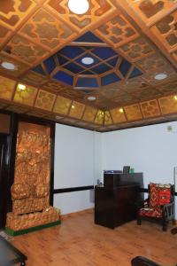 an office room with a wooden ceiling and a desk at Kings palace castle in Cairo