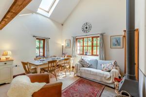 a living room with a couch and a table at 2 Bed in Presteigne oc-75066 in Whitton