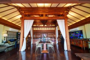a large living room with a table and chairs at Ladylagoon Luxury Multi-Purpose Private Beachfront Villas Koh Samui in Koh Samui