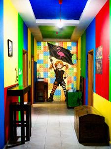 a room with a painting of a man holding a flag at Roof Top Hostel in Tirana