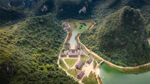 an aerial view of a castle in the middle of a river at Ui Valley Resort in Ninh Binh