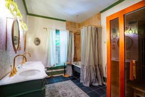 a bathroom with a sink and a tub and a shower at Cozy House with Private Sauna in Maryville +141 photos