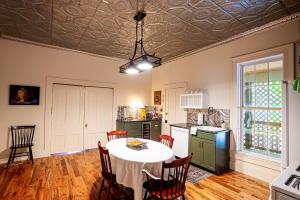 a kitchen with a table and chairs in a room at Cozy House with Private Sauna in Maryville