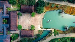 an overhead view of a river and a field at Ui Valley Resort in Ninh Binh