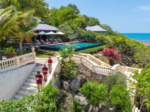 a resort with a staircase leading to a swimming pool at Ladylagoon Luxury Multi-Purpose Private Beachfront Villas Koh Samui in Koh Samui