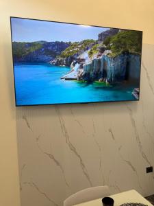 a flat screen tv hanging on a wall at Vittoria & Celeste in Cervino