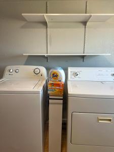 a kitchen with a white stove and a refrigerator at Superhero Family Home Near Downtown Amarillo in Amarillo