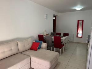 a living room with a couch and a table at Friends-2 in Risan +15 photos