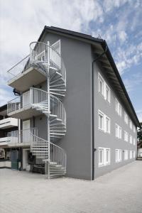 a building with stairs on the side of it at smart studios - by kalm stay in Munich