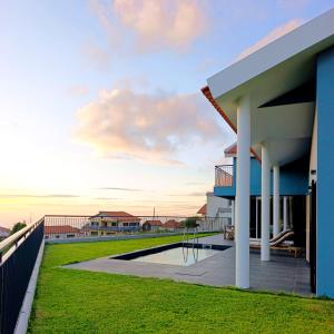 a view of a house with a pool at Sunset Cottage - Special Places in Ponta do Pargo