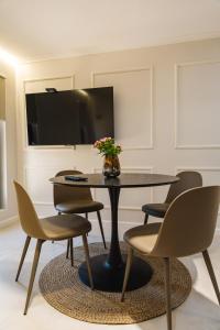 a dining room with a table and chairs at Villa ARTÉ in Shabla