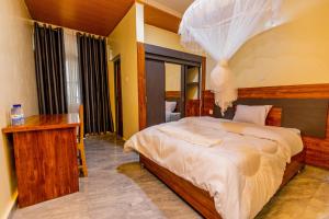 a bedroom with a large bed in a room at Centre Missionnaire Lavigerie in Kigali +117 photos