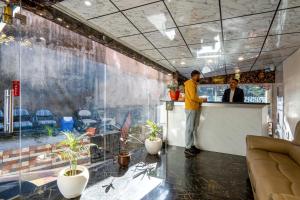 a man standing at the counter of a restaurant at Hotel Windsor in Shimla +62 photos