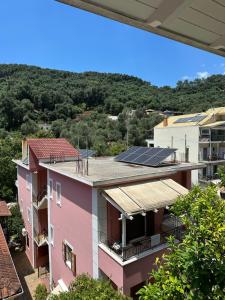 a view of a building with solar panels on the roof at Bianco Boutique in Parga