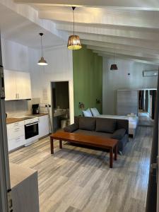 a living room with a couch and a table at Bianco Boutique in Parga