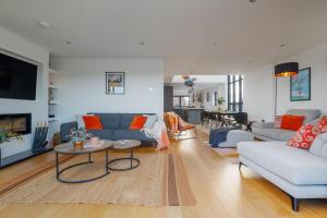a living room with a couch and a table at Silvermere in Warmwell