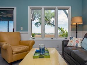 a living room with a couch and a coffee table at 1228 Creekwatch Villa in Seabrook Island