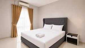 a bedroom with a large white bed with a large window at SleepRest @ The Home Shoutlink in Nagoya +30 photos