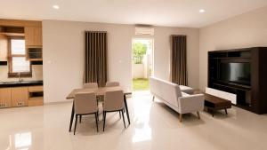 a kitchen and dining room with a table and chairs at SleepRest @ The Home Shoutlink in Nagoya