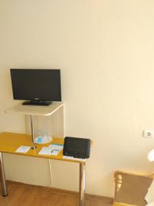 a desk with a computer monitor on top of it at Jaunkemeri in Debeskrogs