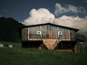 a house on top of a hill in a field at Mtissa in Jut'a