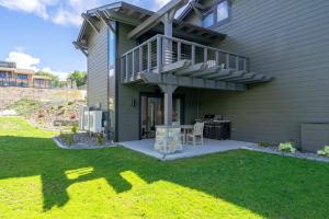 a house with a deck and a patio at High-end Lakefront Condo B6 Wapato Point Chelan in Manson
