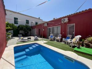 a swimming pool in the yard of a house at Casa Muriana in Alanís
