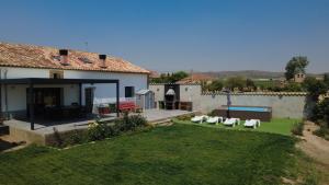 an external view of a house with a yard at Campos de Villalba in Villalba