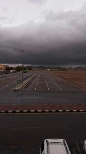 an empty highway with a white truck parked on it at قلب الشمال للشقق الفندقيه in Hail