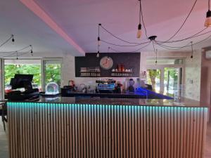 a kitchen with a bar with purple ceilings at Rosiem Boutique in Techirghiol