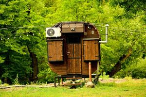 a tree house sitting in the middle of a field at Loft Dilijan in Dilijan