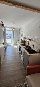 a kitchen with a sink and a stove top oven at Studio "Werkstatt" in Oberndorf in Oberndorf am Neckar