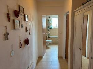 a hallway with a bathroom with a toilet and a sink at Apartmán Deštná čp.1 in Deštné v Orlických horách +16 photos
