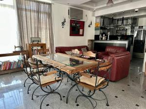 a living room with a table and a couch at WEST GATE free parking & wi-fi in Sutomore
