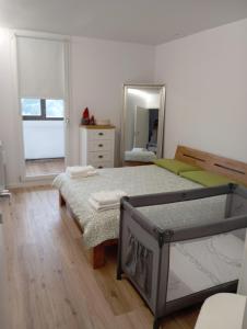 a bedroom with a bed and a large mirror at Il rifugio del cuore in San Massimo