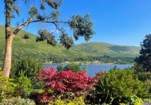 a view of a lake with mountains in the background at Cuil Steading in Cairndow