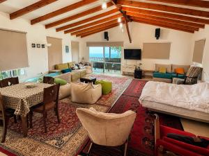 a living room with a couch and a table at la noach in Metulla