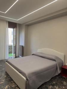 a bedroom with a large bed in a room at Sister House in Cerignola