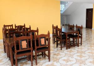 a dining room with a table and chairs at Niru Buddha Hotel, Lumbini in Rummindei