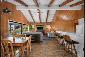 a kitchen and dining room with a table and chairs at Anchor Lodge in Fort Bragg