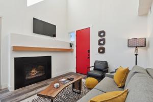 a living room with a couch and a fire place at Quarry A21 in Whitefish