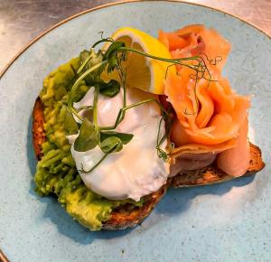 a sandwich with eggs and vegetables on a plate at The Poppy House in Bishops Castle +11 photos