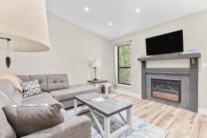 a living room with a couch and a fireplace at Timber and Trail in Kimberling City