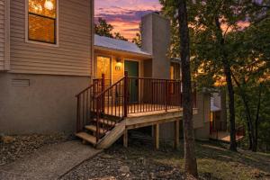 a house with a wooden deck in front of it at Timber and Trail in Kimberling City