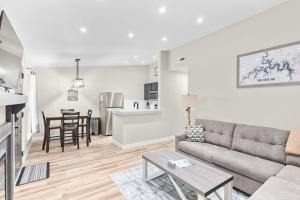 a living room with a couch and a table at Timber and Trail in Kimberling City