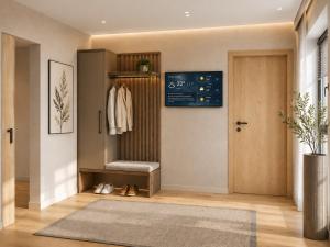 a hallway with a walk in closet with a door at Alpine Residence by alpenappartements in Mayrhofen +27 photos